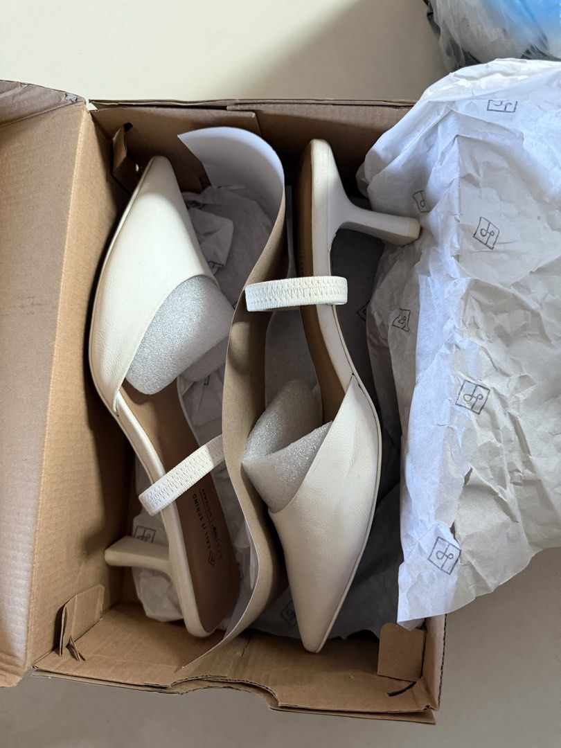 Call It Spring White Vegan Pointed Toe Heels (Category: Heels) located in Manila. Submitted by kristielyntan (Listing ID 1461816114, Image 3). Description: - White Call It Spring pointed toe heels - Size: 7.5 - Material: Vegan - Features: Elastic strap across the foot for a secure fit - Heel Height: Low - Includes: Original box and packaging.