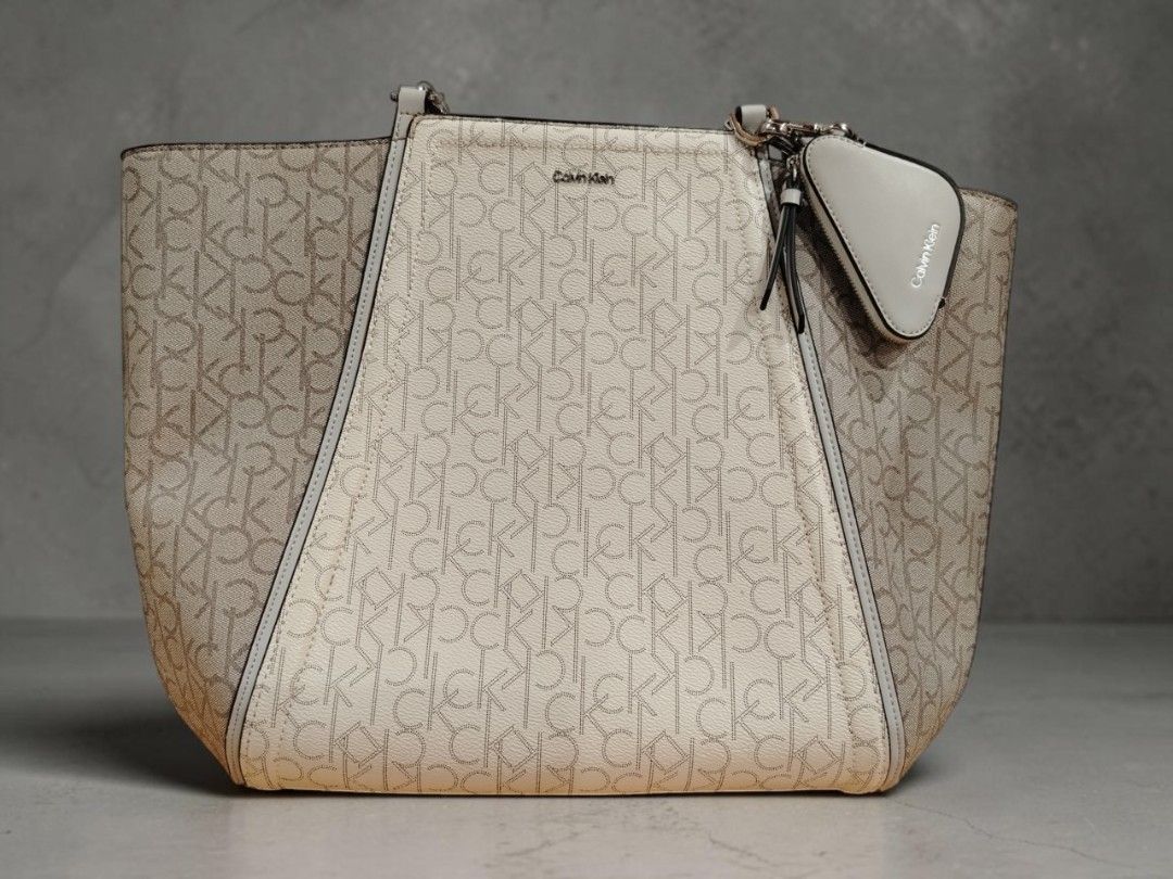 Calvin Klein Garnet Triple Compartment Monogram Tote Bag (Category: Luxury Bags & Wallets) located in Taguig. Submitted by crlmrjn (Listing ID 1461997592, Image 1). Description: Pm for more AUTHENTIC] Calvin Klein Garnet Triple Compartment Monogram Tote Bag Price: ₱4,500 Negotiable Condition: 9.5/10 (Almost new / Like new condition) Inclusions: As-is / Bag only (Does not come with original box or dust bag) Product Details: Model Code: H4DAJLR4 (M