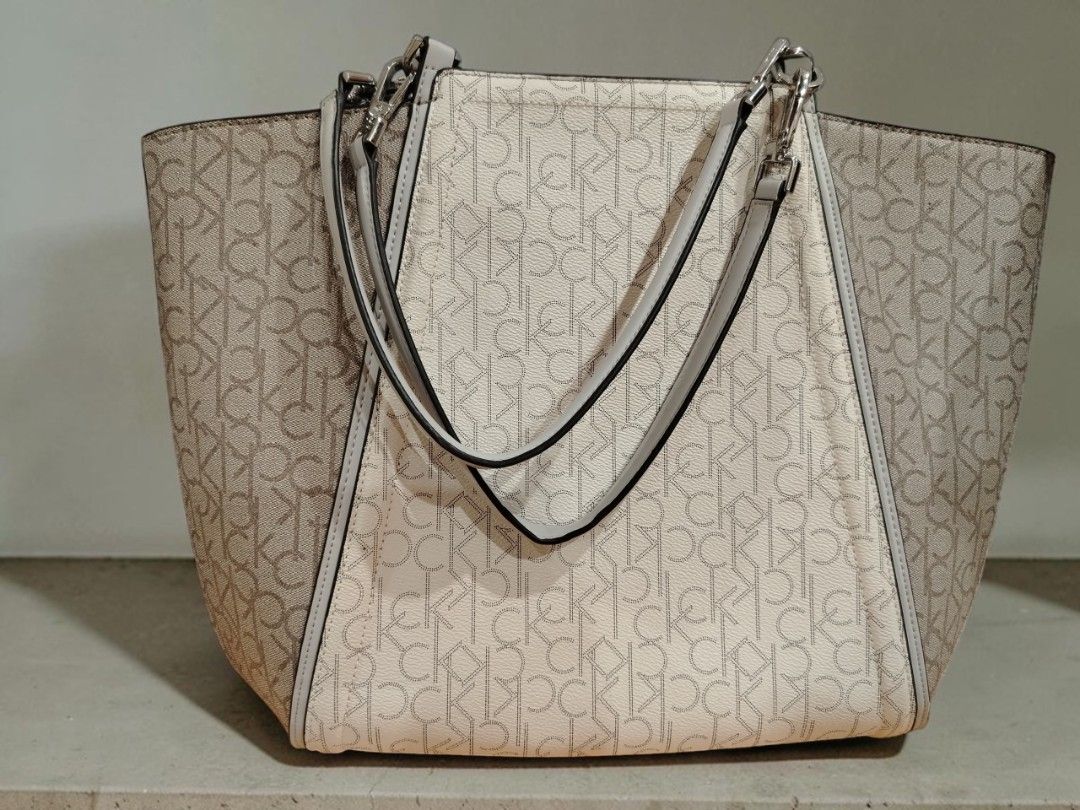 Calvin Klein Garnet Triple Compartment Monogram Tote Bag (Category: Luxury Bags & Wallets) located in Taguig. Submitted by crlmrjn (Listing ID 1461997592, Image 2). Description: Pm for more AUTHENTIC] Calvin Klein Garnet Triple Compartment Monogram Tote Bag Price: ₱4,500 Negotiable Condition: 9.5/10 (Almost new / Like new condition) Inclusions: As-is / Bag only (Does not come with original box or dust bag) Product Details: Model Code: H4DAJLR4 (M