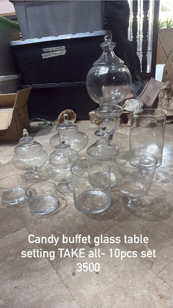 Candy Buffet Glass Table Setting - 10pcs Set (Category: Other Kitchenware & Tableware) located in Taguig. Submitted by firesale123 (Listing ID 1461826831, Image 1). Description: - Set of 10 assorted glass jars - Ideal for candy buffet tables - Perfect for parties and events - Various sizes and styles included - Take all for P3500 - Message if interested.