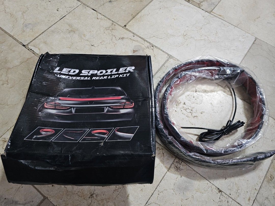 CARBON LED SPOILER REAR LIP KIT (Category: Lightings, Horns, and other Electrical Parts and Accessories) located in San Mateo. Submitted by reyshel08 (Listing ID 1461844548, Image 2). Description: - Carbon fiber look rear lip spoiler with integrated LED light strip - Universal fit for most car models - Enhances sporty and modern aesthetics - Provides a unique visual accent, especially at night - Easy to install.