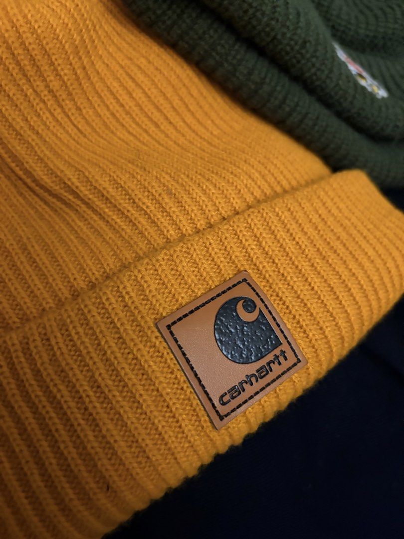 Carhartt & Human Made Beanies Bundle (Category: Hats & Beanies) located in Manila. Submitted by finderskeepersmnl_092026 (Listing ID 1461959348, Image 3). Description: - Bundle includes two ribbed knit beanies. - Carhartt beanie: Mustard yellow with classic logo patch. - Human Made beanie: Dark green with a cute duck patch. - Both are great for keeping warm..