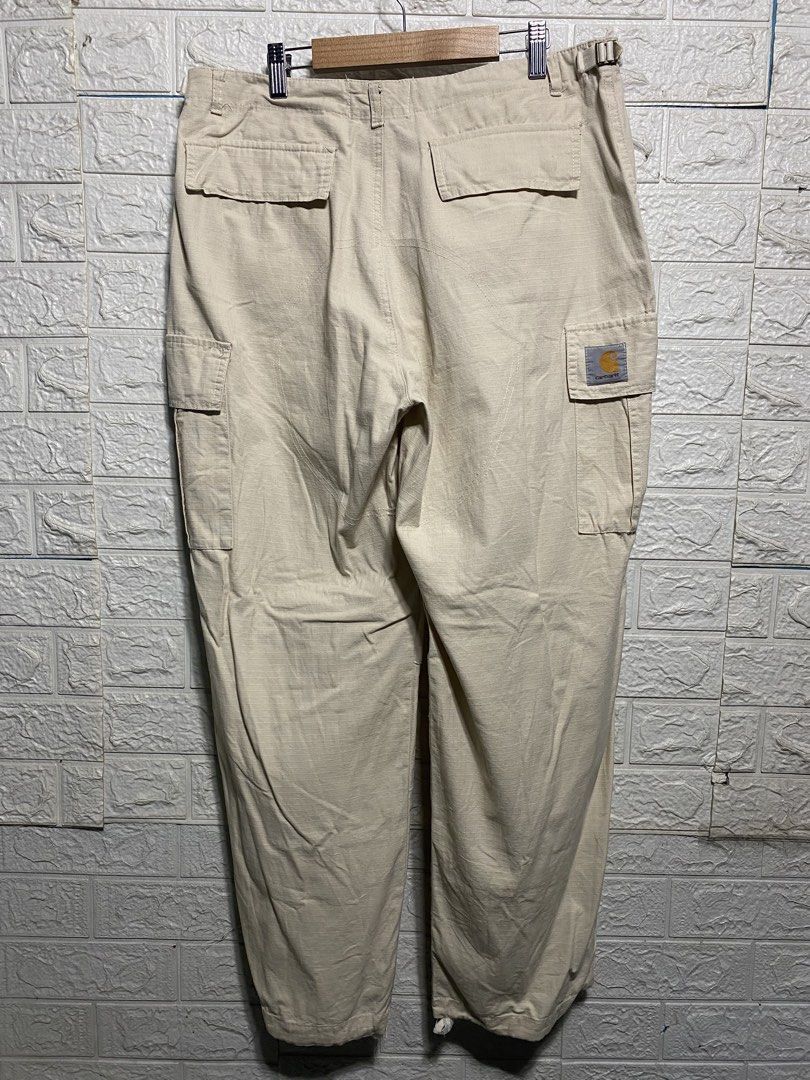 Carhartt Cargo Pants Beige Men's Size [Size] (Category: Jeans) located in Naga. Submitted by thesource4400 (Listing ID 1461953530, Image 2). Description: - Classic Carhartt cargo pants in neutral beige. - Durable material, built to last. - Multiple pockets for storage. - Button and zip fly closure. - Versatile for work or casual outfits..