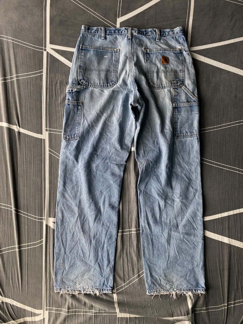 Carhartt Light Wash Denim Carpenter Jeans (Category: Jeans) located in Manila. Submitted by raymondrob54698 (Listing ID 1461851849, Image 1). Description: - Light wash Carhartt carpenter jeans - Classic workwear style - Multiple pockets and hammer loop - Distressed details on knees and hem - Relaxed fit - Great for everyday wear or workwear aesthetic.