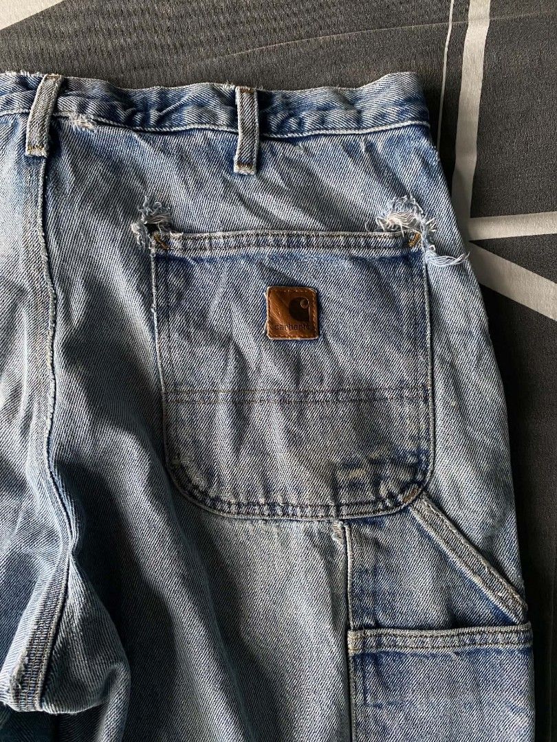 Carhartt Light Wash Denim Carpenter Jeans (Category: Jeans) located in Manila. Submitted by raymondrob54698 (Listing ID 1461851849, Image 2). Description: - Light wash Carhartt carpenter jeans - Classic workwear style - Multiple pockets and hammer loop - Distressed details on knees and hem - Relaxed fit - Great for everyday wear or workwear aesthetic.