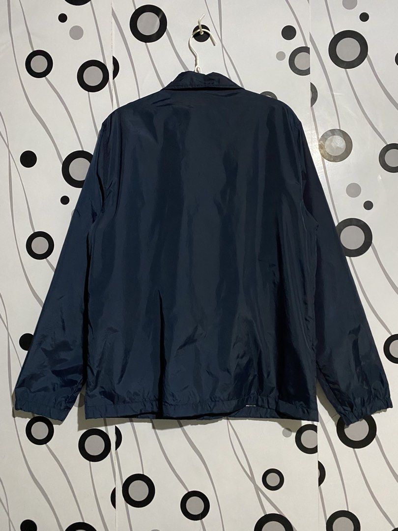 Carhartt WIP coach's jacket (Category: Coats, Jackets and Outerwear) located in Cebu City. Submitted by patspickph (Listing ID 1461862914, Image 2). Description: This is a dark blue Carhartt WIP coach's jacket with a pointed collar and snap buttons. Size Medium on tag dimensions is W22 L28. Excellent Condition👌.