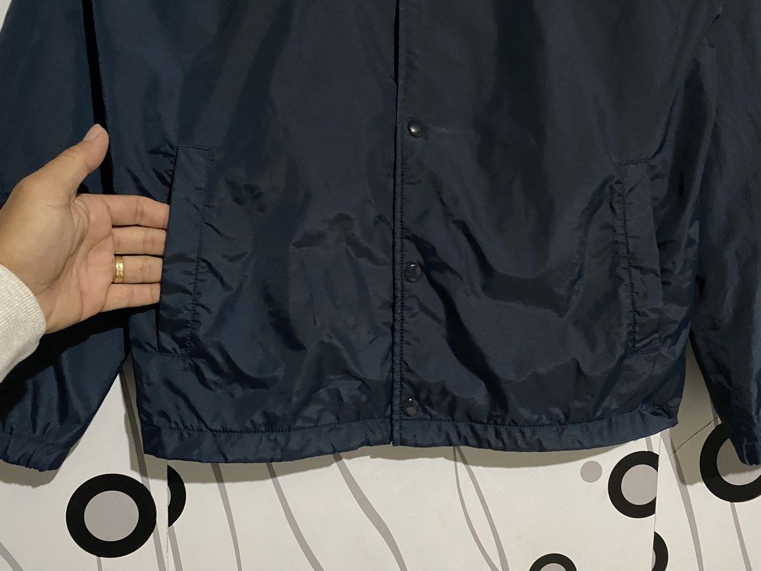 Carhartt WIP coach's jacket (Category: Coats, Jackets and Outerwear) located in Cebu City. Submitted by patspickph (Listing ID 1461862914, Image 3). Description: This is a dark blue Carhartt WIP coach's jacket with a pointed collar and snap buttons. Size Medium on tag dimensions is W22 L28. Excellent Condition👌.