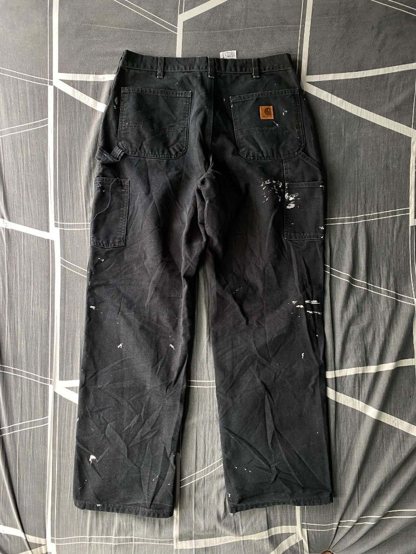 Carhartt WIP Work Pants Black Paint Splatter (Category: Jeans) located in Manila. Submitted by raymondrob54698 (Listing ID 1461852491, Image 1). Description: - Carhartt WIP work pants - Color: Black - Unique paint splatter detailing - Classic design - Size: 34x32 - Made in Mexico - Ideal for workwear or streetwear looks.