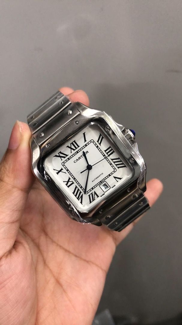Cartier Santos Automatic Stainless Steel (Category: Luxury Watches) located in Caloocan City. Submitted by mrbigdreams (Listing ID 1461907117, Image 3). Description: - Authentic Cartier Santos watch - Automatic movement - Stainless steel bracelet - White dial with Roman numerals - Date window at 6 o'clock - Signature blue cabochon crown - Classic square case design - Versatile for daily wear or special events.