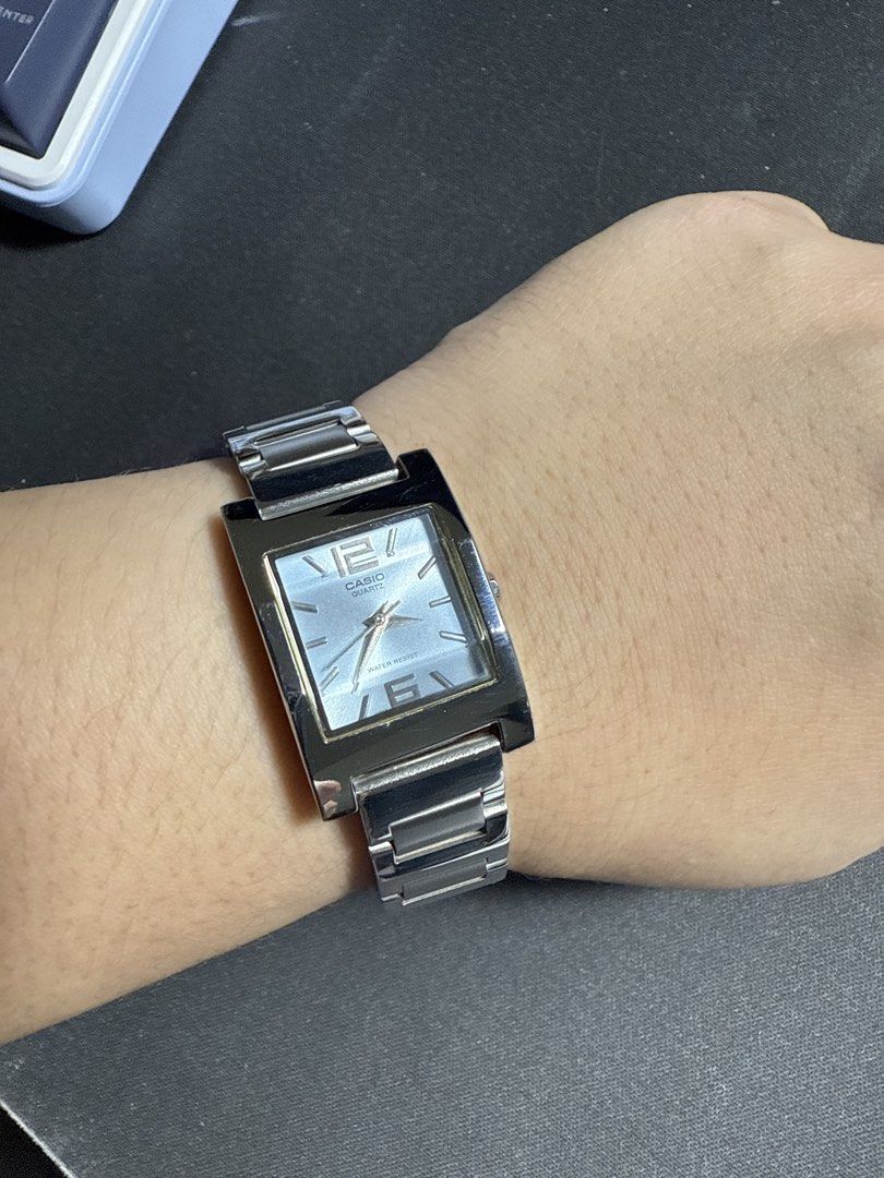 Casio Quartz Watch LTP-1238 Silver Tone (Category: Women's Watches) located in Manila. Submitted by thriftwitlove (Listing ID 1461911305, Image 1). Description: - Silver tone Casio watch - Square face with a light blue dial - Quartz movement - Water resistant - Metal link band with fold-over clasp - Minor scuffs on band and casing - Works well.