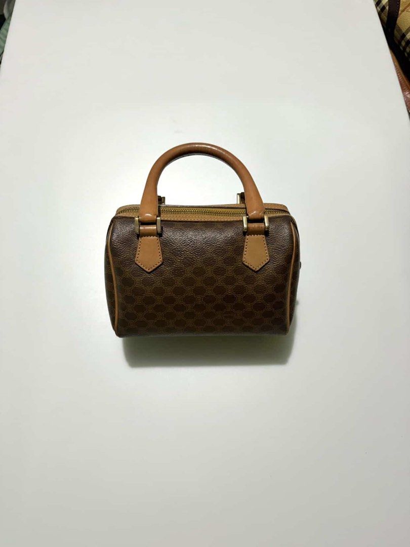 Celine Mini Boston Bag Monogram Brown (Category: Luxury Bags & Wallets) located in Manila. Submitted by hanagblibr77608 (Listing ID 1461875691, Image 1). Description: - Classic Celine mini Boston bag - Iconic monogram print - Color: Brown with tan leather accents - Closure: Zipper - Handles: Top handles for carrying - Size: Small and compact - Perfect for: Everyday use or a night out.