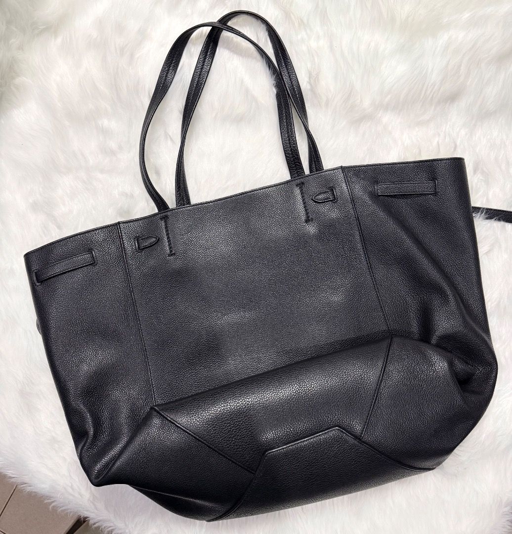 Celine Phantom Tie Cabas Leather Medium Tote Bag (Category: Luxury Bags & Wallets) located in Taytay. Submitted by kgisdancing (Listing ID 1461867387, Image 2). Description: - Brand: Celine - Model: Phantom Tie Cabas Tote Bag - Size: Medium - Material: Textured Leather - Features: Interior zip pocket, slip pockets, drawstring closure - Condition: Good - Ideal for: Everyday use, travel.