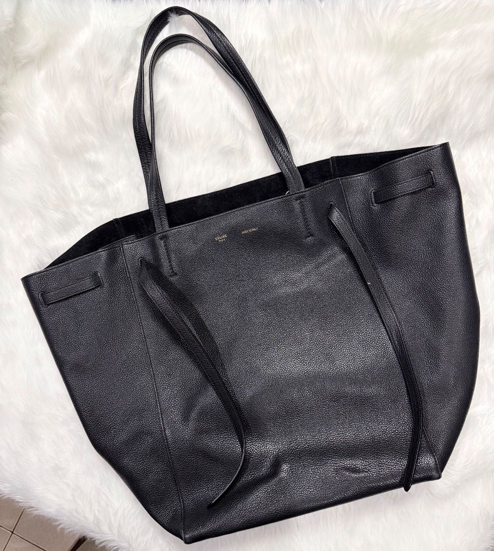 Celine Phantom Tie Cabas Leather Medium Tote Bag (Category: Luxury Bags & Wallets) located in Taytay. Submitted by kgisdancing (Listing ID 1461867387, Image 1). Description: - Brand: Celine - Model: Phantom Tie Cabas Tote Bag - Size: Medium - Material: Textured Leather - Features: Interior zip pocket, slip pockets, drawstring closure - Condition: Good - Ideal for: Everyday use, travel.