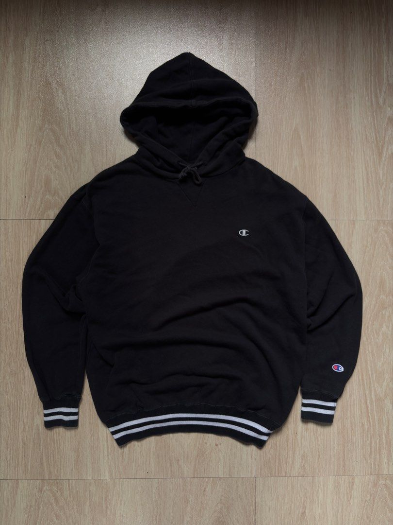 Champion Black Hoodie Medium Striped Cuffs (Category: Coats, Jackets and Outerwear) located in Manila. Submitted by pusherneeds (Listing ID 1461909258, Image 1). Description: - Classic black Champion hoodie - Iconic C logo on chest and sleeve - Ribbed cuffs with white stripes - Drawstring hood - Comfortable and casual - Great for everyday wear.