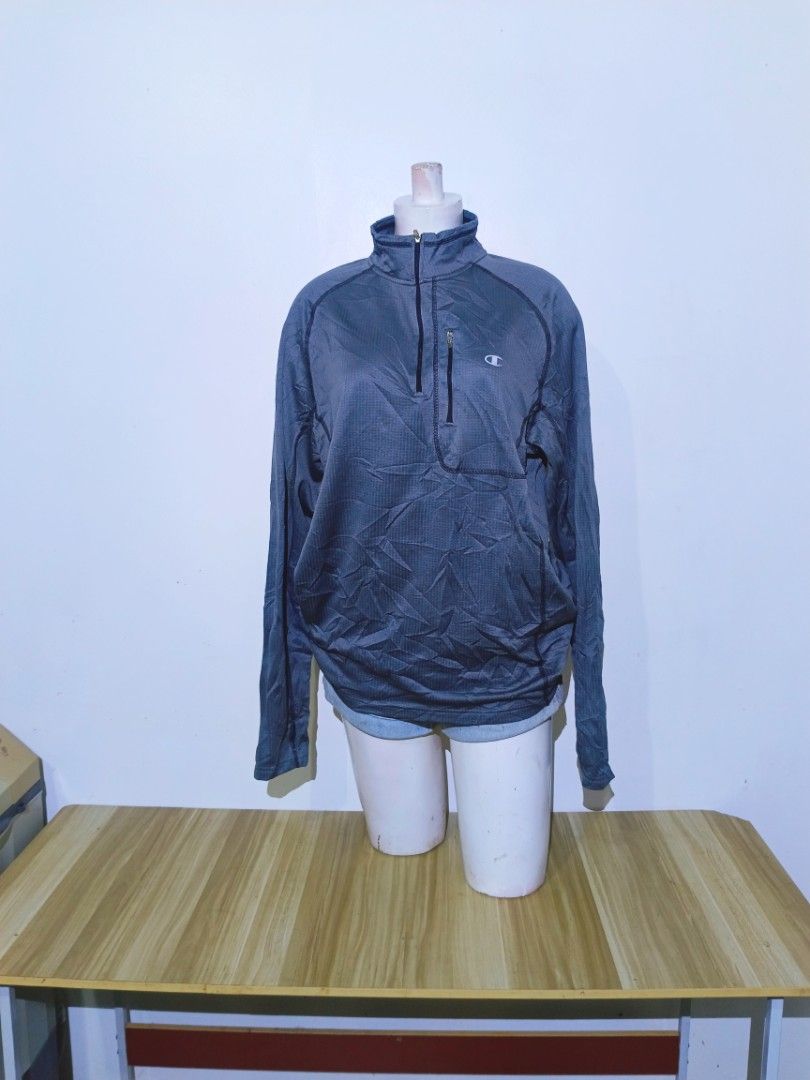Champion Men's Grey Quarter Zip Pullover Jacket Size L (Category: Coats, Jackets and Outerwear) located in Bayambang. Submitted by meowww1819 (Listing ID 1461951894, Image 1). Description: - Champion Quarter Zip Pullover Jacket - Color: Grey with subtle textured pattern - Features: Zippered chest pocket, stand-up collar - Versatile: Ideal for workouts or casual wear - Size: Large (L).