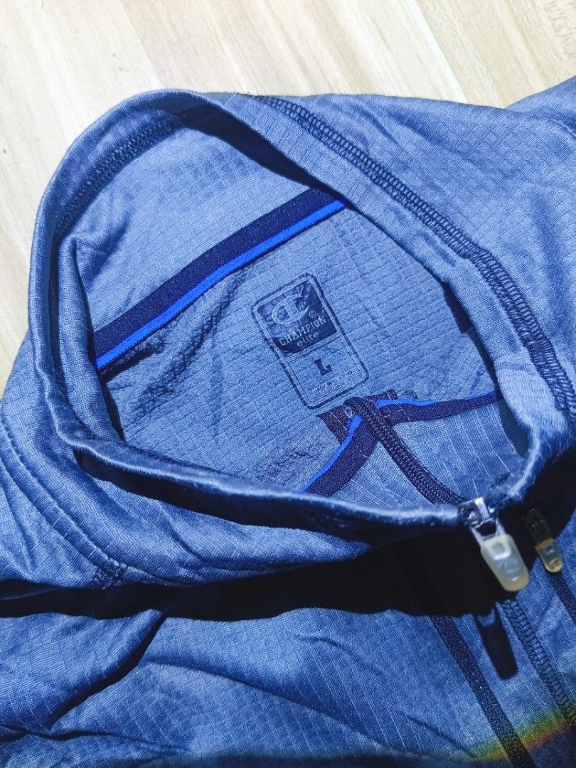 Champion Men's Grey Quarter Zip Pullover Jacket Size L (Category: Coats, Jackets and Outerwear) located in Bayambang. Submitted by meowww1819 (Listing ID 1461951894, Image 3). Description: - Champion Quarter Zip Pullover Jacket - Color: Grey with subtle textured pattern - Features: Zippered chest pocket, stand-up collar - Versatile: Ideal for workouts or casual wear - Size: Large (L).