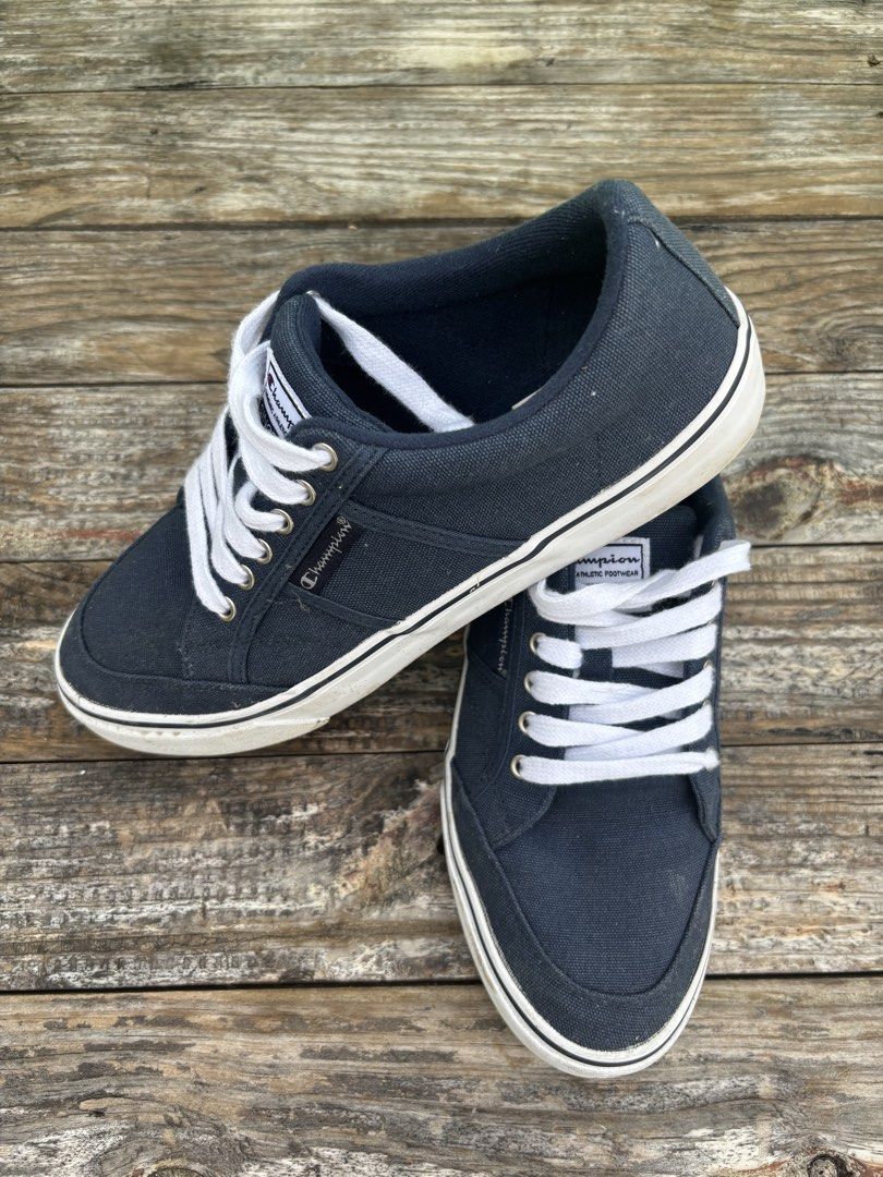 Champion placard low-top canvas (Category: Sneakers) located in Manila. Submitted by cjakesilv84194 (Listing ID 1461856235, Image 3). Description: - Navy blue Champion low-top sneakers - Classic white laces - Vintage 'Since 1919' detail - Comfortable for daily wear - Ideal for casual outfits - Please check photos for detailed condition.