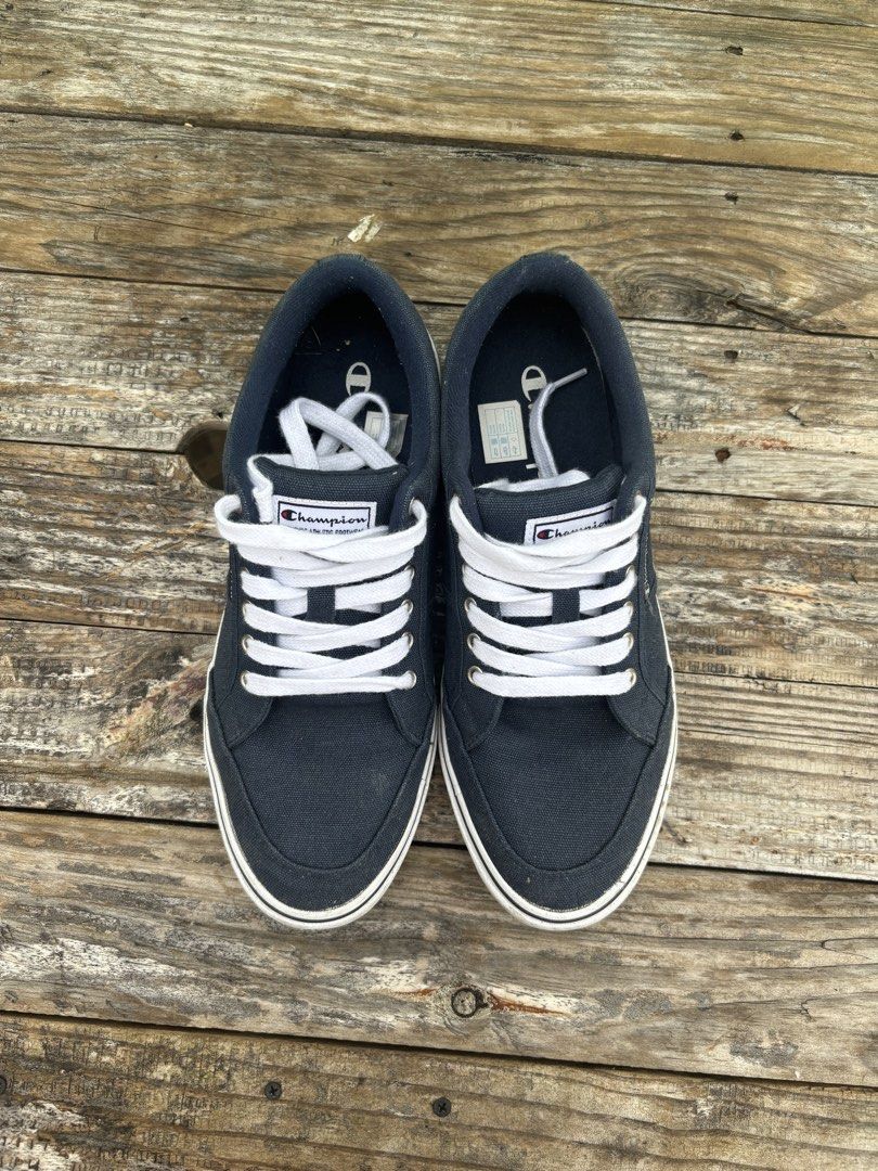 Champion placard low-top canvas (Category: Sneakers) located in Manila. Submitted by cjakesilv84194 (Listing ID 1461856235, Image 1). Description: - Navy blue Champion low-top sneakers - Classic white laces - Vintage 'Since 1919' detail - Comfortable for daily wear - Ideal for casual outfits - Please check photos for detailed condition.