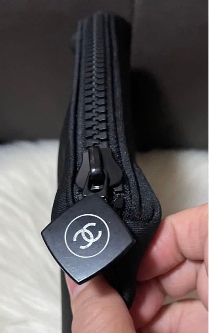 Chanel Black Cosmetic Pouch (Category: Luxury Bags & Wallets) located in Cebu City. Submitted by ludz_0246_2.0 (Listing ID 1461935902, Image 3). Description: - Authentic Chanel pouch - Zipper closure with branded charm - Ideal for makeup or small essentials - Made of durable material - Clean interior and exterior - Perfectly sized to fit inside your handbag.