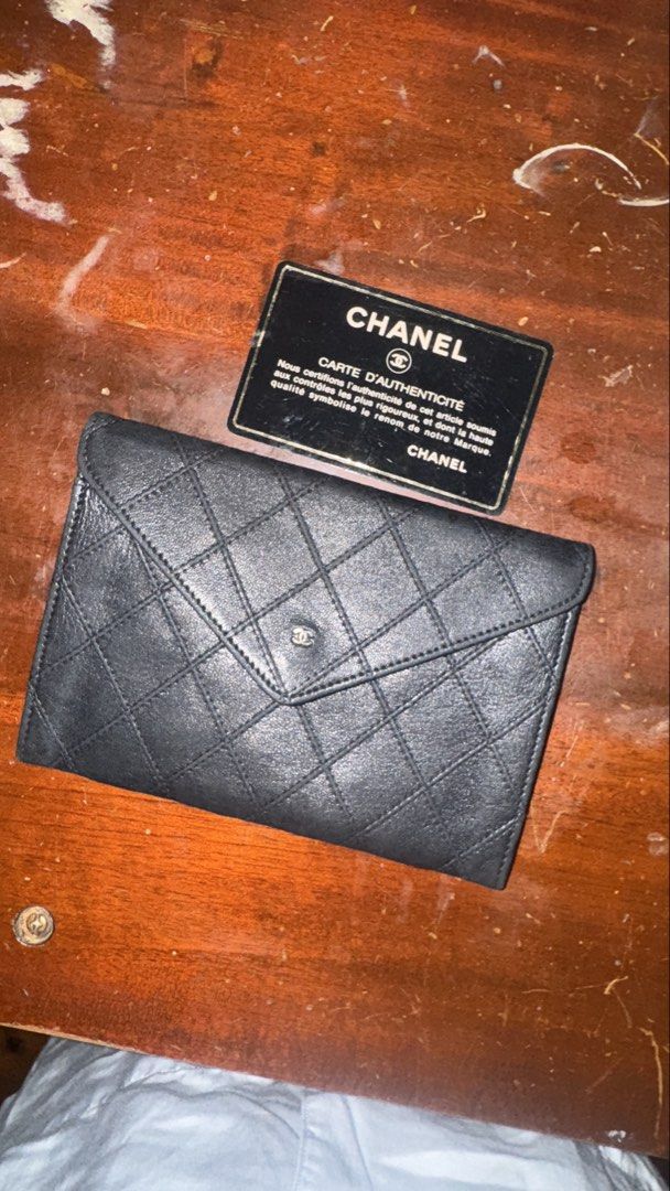 Chanel Black Quilted Leather Wallet (Category: Luxury Bags & Wallets) located in Quezon City. Submitted by kb0030 (Listing ID 1461955764, Image 1). Description: Well used! Clean but can get a bag spa - Authentic black Chanel wallet - Classic quilted leather design - Comes with authenticity card - Interior features Chanel logo - Plenty of space for cards and cash - A timeless and essential accessory.
