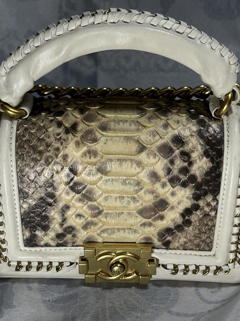 Chanel Boy Bag Python Leather White Gold Chain (Category: Luxury Bags & Wallets) located in General Santos City (Dadiangas). Submitted by maisonmargiela2004 (Listing ID 1461988909, Image 3). Description: - Elegant white leather handbag - Luxurious python skin accents - Versatile gold chain strap and top handle - Iconic Chanel CC lock closure - Interior: Chanel Made in France label - Authenticity card included (Serial Number: 31286898) - Perfect a