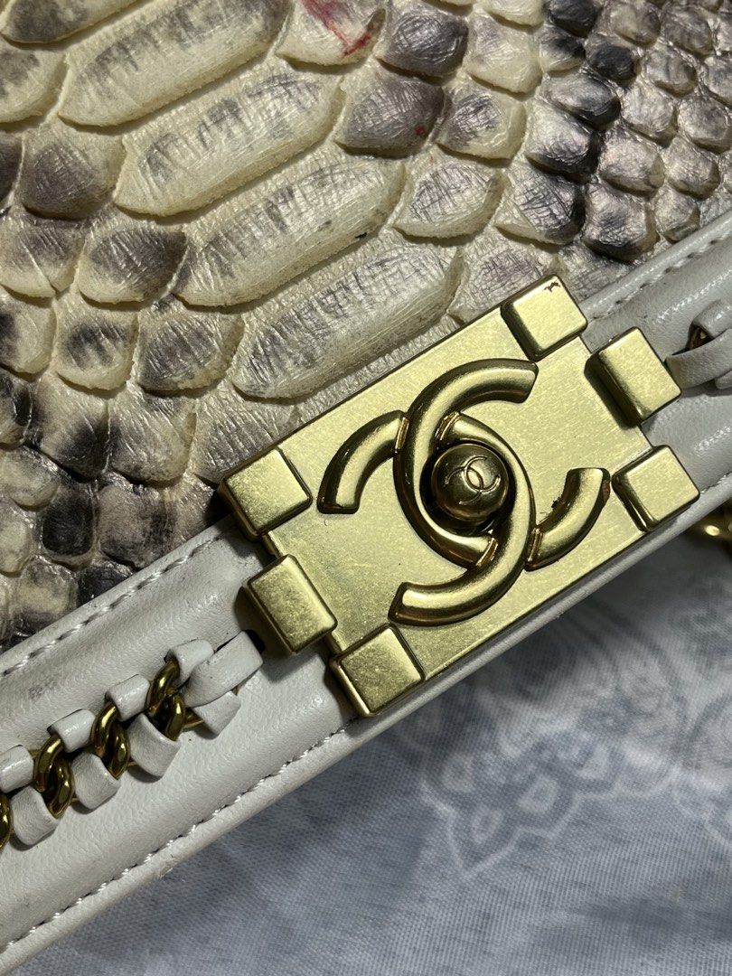 Chanel Boy Bag Python Leather White Gold Chain (Category: Luxury Bags & Wallets) located in General Santos City (Dadiangas). Submitted by maisonmargiela2004 (Listing ID 1461988909, Image 2). Description: - Elegant white leather handbag - Luxurious python skin accents - Versatile gold chain strap and top handle - Iconic Chanel CC lock closure - Interior: Chanel Made in France label - Authenticity card included (Serial Number: 31286898) - Perfect a