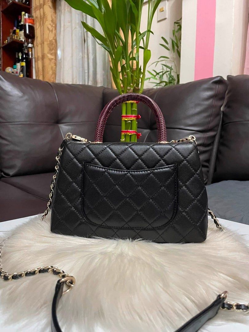 Chanel Classic Flap Bag Black Caviar Leather (Category: Luxury Bags & Wallets) located in Cebu City. Submitted by ludz_0246_2.0 (Listing ID 1461943852, Image 2). Description: - Classic Chanel flap bag - Black caviar leather with quilted pattern - Gold hardware and chain strap - Unique braided top handle - Convenient back pocket - Detachable shoulder strap included - Versatile for day or night use.