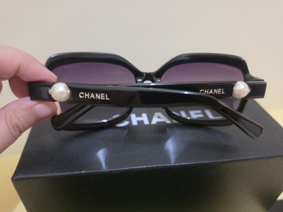 Chanel Pearl Black Sunglasses (Category: Sunglasses & Eyewear) located in Cavite. Submitted by kazi_preloved (Listing ID 1461857813, Image 2). Description: - Authentic Chanel sunglasses - Classic black frame with elegant pearl details and visibly written Chanel on the arms - Comes with original box, and case, and card. Note that case is already worn out. - no visible hairline scratches on the glasses and frame, but only 1 little scratch on the pe