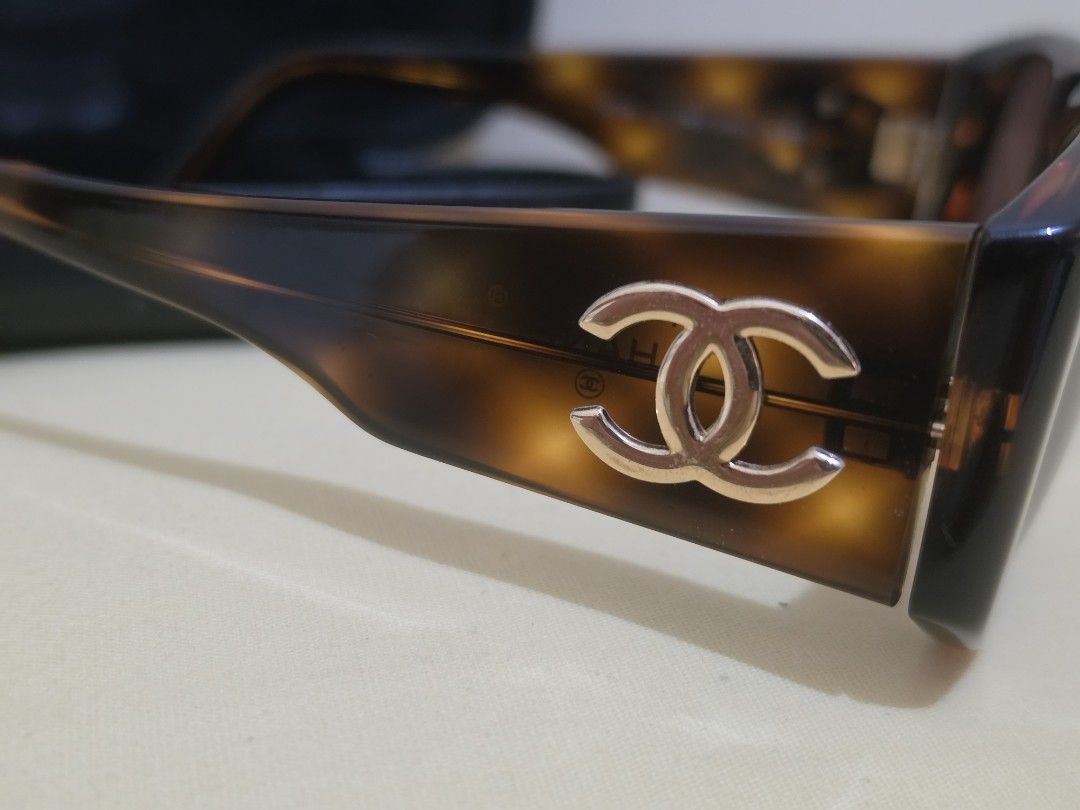 Chanel Tortoiseshell CC Gold Logo Sunglasses (Category: Sunglasses & Eyewear) located in Cavite. Submitted by kazi_preloved (Listing ID 1461860267, Image 3). Description: - Authentic Chanel Sunglasses - Tortoiseshell frame with gold CC logo - Comes with original Chanel case - minimal hairline scratches on the frame. - fits small face. - Made in Italy.