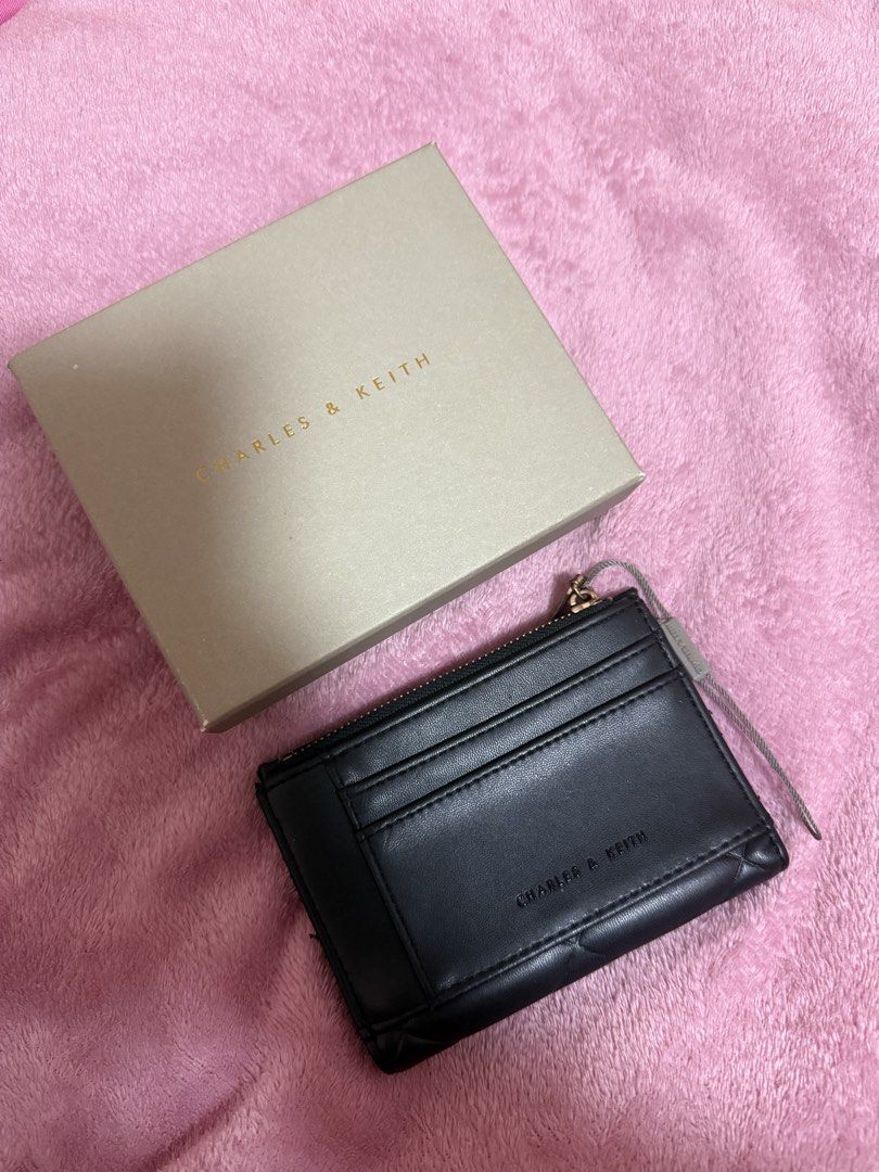 CHARLES & KEITH BLACK LEATHER WALLET (Category: Wallets & Card holders) located in Quezon City. Submitted by frannecess (Listing ID 1461985153, Image 1). Description: 🌸 FOR SALE 🌸 CHARLES & KEITH BLACK LEATHER WALLET With box only Loc: Pasong Tamo, Quezon City.