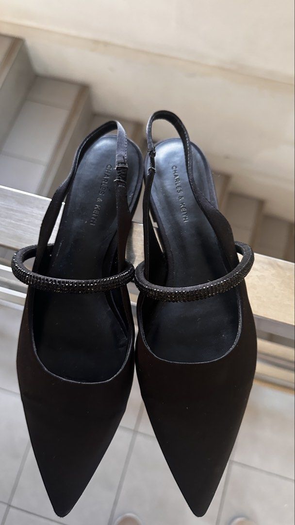 Charles & Keith Black Slingback Pointed Flats with Embellishment (Category: Flats & Sandals) located in Manila. Submitted by abibantaya24257 (Listing ID 1461892579, Image 3). Description: - Brand: Charles & Keith, size 38 (womens) - Style: Black pointed slingback flats - Features: Delicate strap with subtle embellishments - Design: Easy slip-on - Versatility: Suitable for everyday wear or special occasions - RFS: not using, owner switched to snea