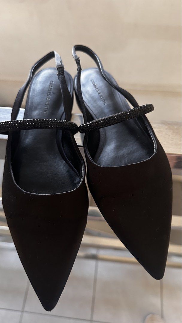 Charles & Keith Black Slingback Pointed Flats with Embellishment (Category: Flats & Sandals) located in Manila. Submitted by abibantaya24257 (Listing ID 1461892579, Image 2). Description: - Brand: Charles & Keith, size 38 (womens) - Style: Black pointed slingback flats - Features: Delicate strap with subtle embellishments - Design: Easy slip-on - Versatility: Suitable for everyday wear or special occasions - RFS: not using, owner switched to snea