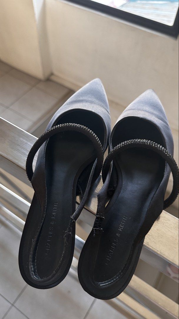 Charles & Keith Black Slingback Pointed Flats with Embellishment (Category: Flats & Sandals) located in Manila. Submitted by abibantaya24257 (Listing ID 1461892579, Image 1). Description: - Brand: Charles & Keith, size 38 (womens) - Style: Black pointed slingback flats - Features: Delicate strap with subtle embellishments - Design: Easy slip-on - Versatility: Suitable for everyday wear or special occasions - RFS: not using, owner switched to snea