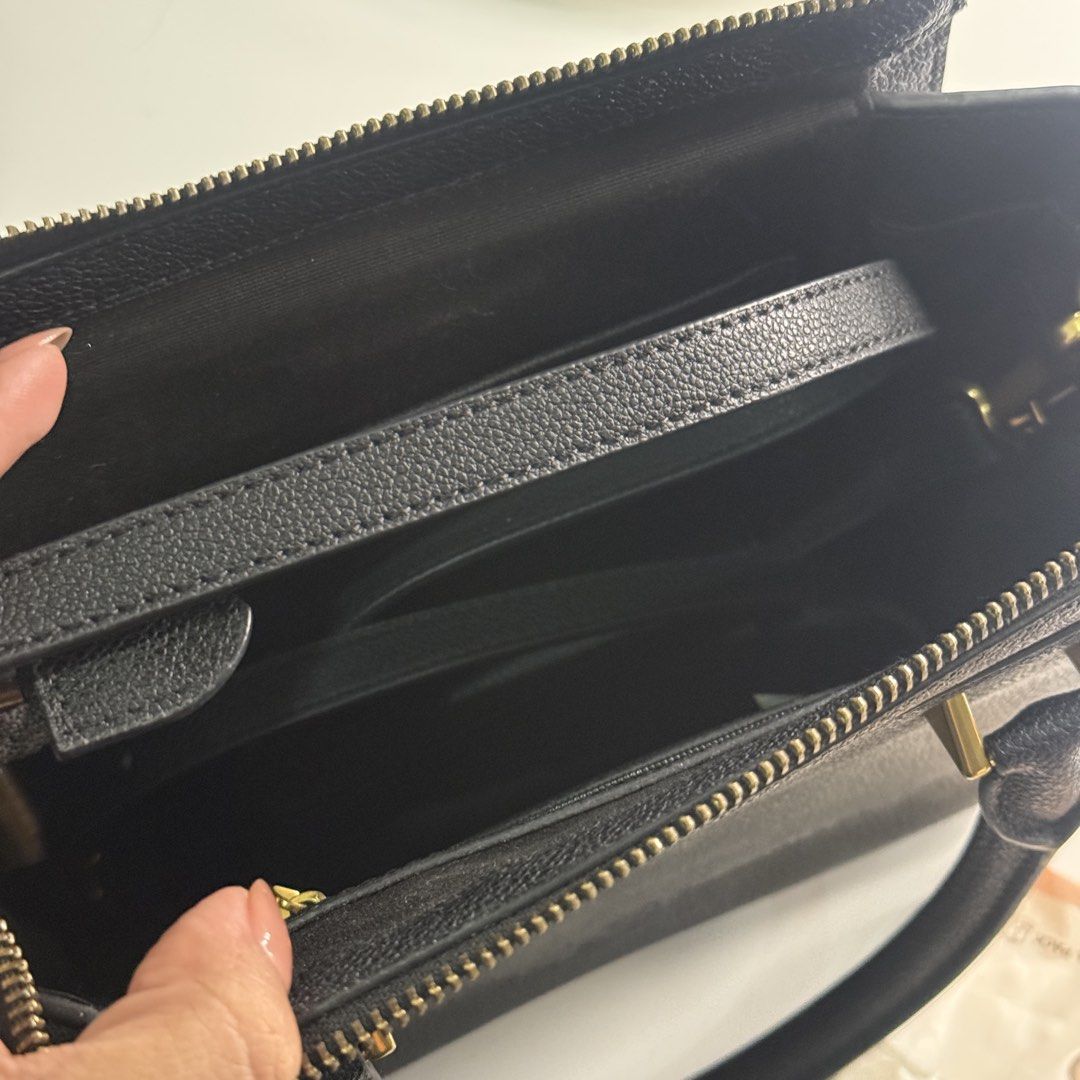 Charles & Keith Black Trapeze Tote Bag (Category: Luxury Bags & Wallets) located in Pateros City. Submitted by sachiereyes (Listing ID 1462005085, Image 3). Description: - Classic black top handle bag by Charles & Keith - Structured design with elegant gold hardware - Secure zip closure - Spacious interior compartment - Includes a detachable shoulder strap for versatile wear - Ideal for both daily use and dressing up outfits.