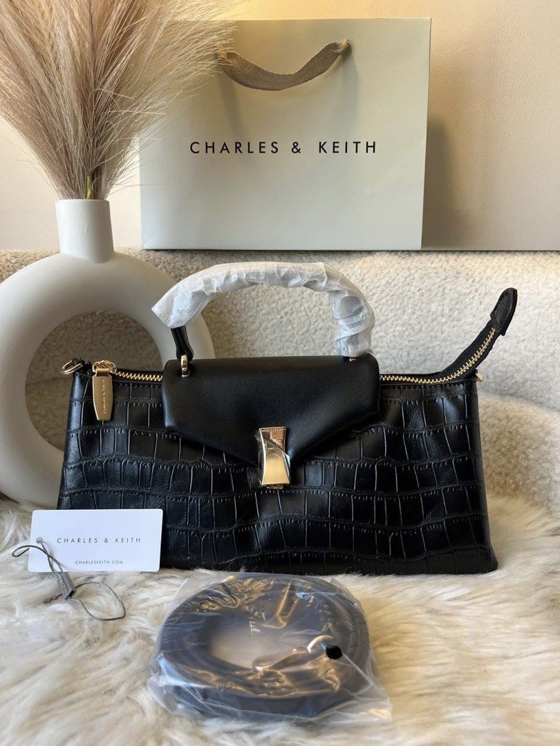 Charles & Keith Top Handle Bag - Black Croc (Category: Cross-body Bags) located in Pasig City. Submitted by preloved.closet2 (Listing ID 1461881535, Image 1). Description: Top Handle Bag With Sling Color Black croc effect Add paperbag plus 80 .