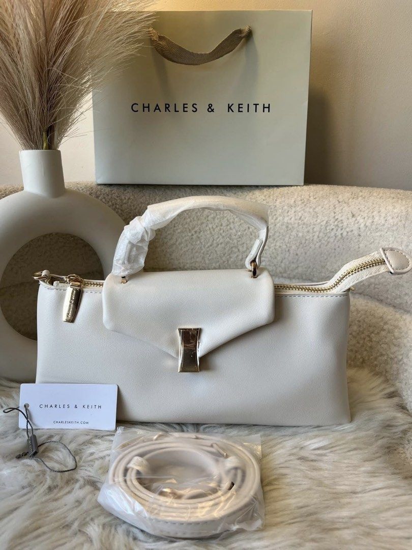 Charles & Keith Top Handle Bag - Cream (Category: Cross-body Bags) located in Pasig City. Submitted by preloved.closet2 (Listing ID 1461882241, Image 1). Description: Top Handle Bag With Sling Color Cream Add paperbag plus 80 .