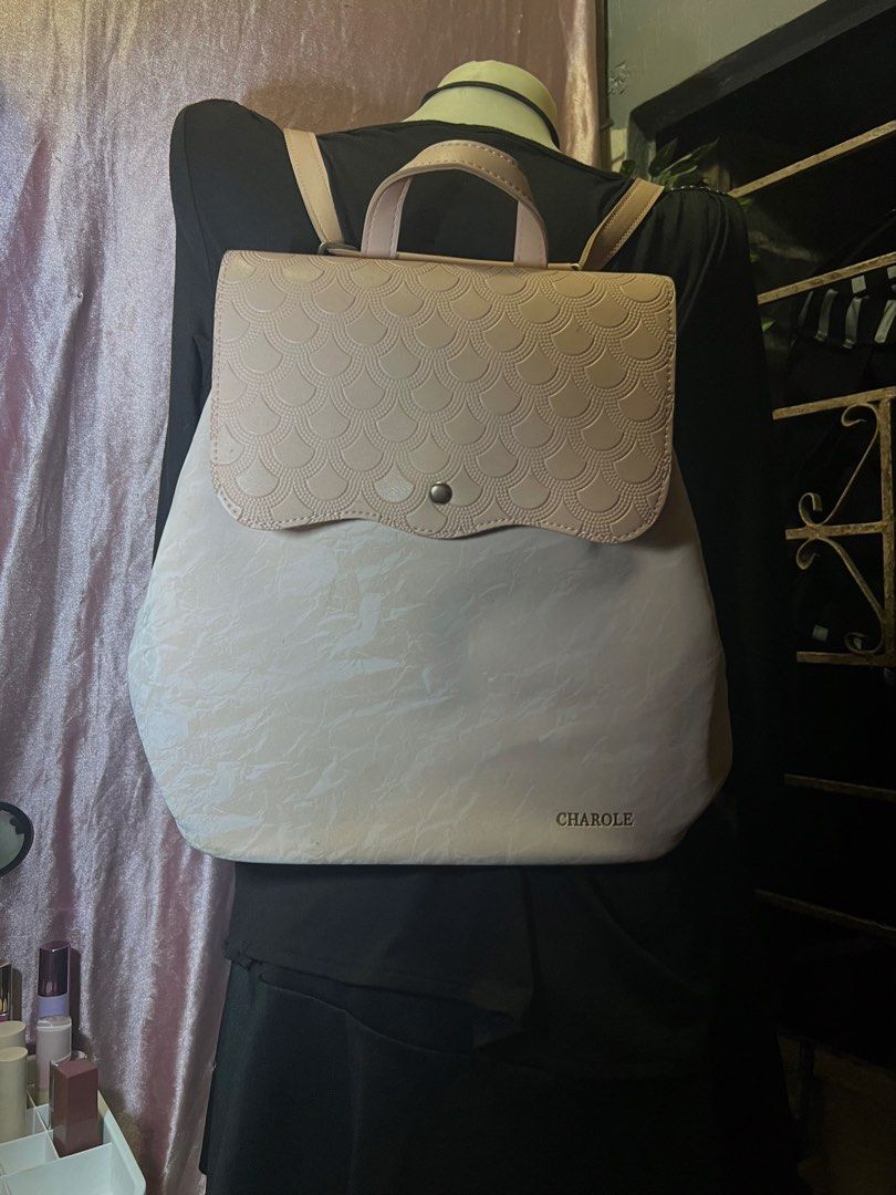 Charole Pink Scallop Flap Backpack (Category: Backpacks) located in Rizal. Submitted by evermourn777 (Listing ID 1461968911, Image 2). Description: - 2 way adjustable strap - scallop pattern on the flap - spacious interior with zipper compartment inside negotiable .