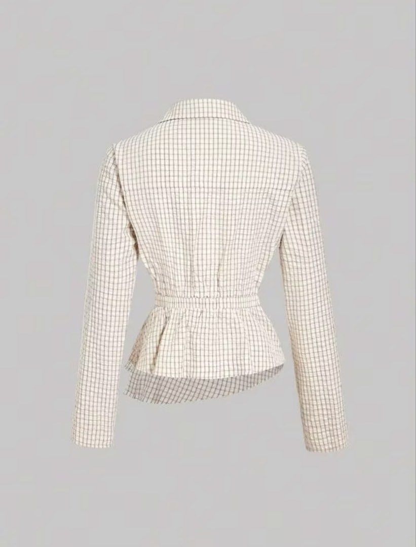 Checkered Wrap Long Sleeve Blouse (Category: Blouses) located in Villasis. Submitted by juliaxgamboa (Listing ID 1461881972, Image 2). Description: - Cream and brown checkered wrap blouse - Long sleeves - Button closure at the front - Cinched waist detail at the back - Versatile for smart casual looks with skirts or trousers.
