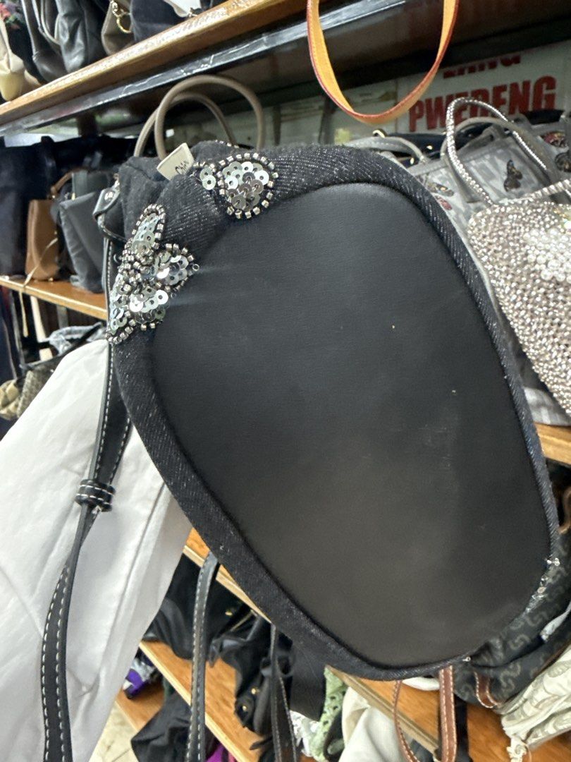 Chio'nd Denim Crossbody Bag with Sequins (Category: Cross-body Bags) located in Manila. Submitted by fastlion.584bdf (Listing ID 1461813575, Image 3). Description: - Stylish denim crossbody bag - Adorable sequin flower embellishments - Durable leather-like base and strap - Contrasting white stitching for a chic look - "Chio'nd" brand tag - Spacious interior for your essentials - Ideal for everyday casual outings.