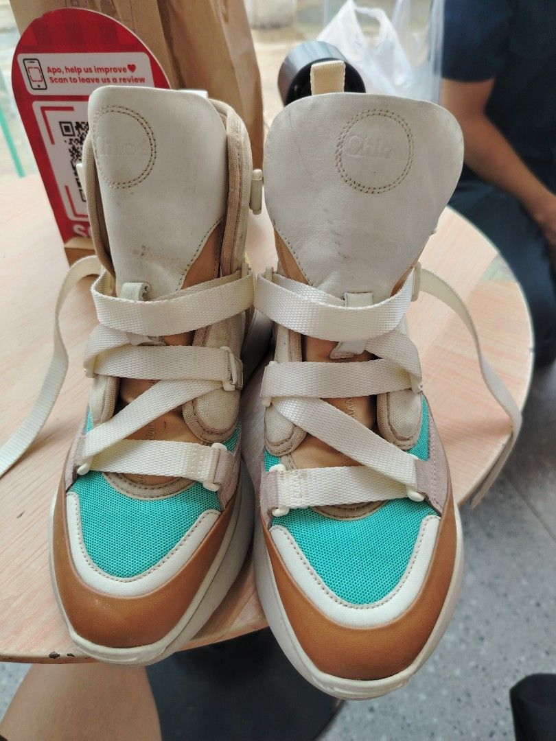 Chloe Sonnie High Top Sneakers, size 7 (Category: Sneakers) located in Manila. Submitted by purediamond888 (Listing ID 1462000993, Image 2). Description: - Chloe Sonnie high top sneakers - Unique color block design: beige, tan, pink, and turquoise panels - Chunky sole for comfort and style - Lace-up closure with adjustable straps - Perfect for adding a pop of color - A true statement piece.