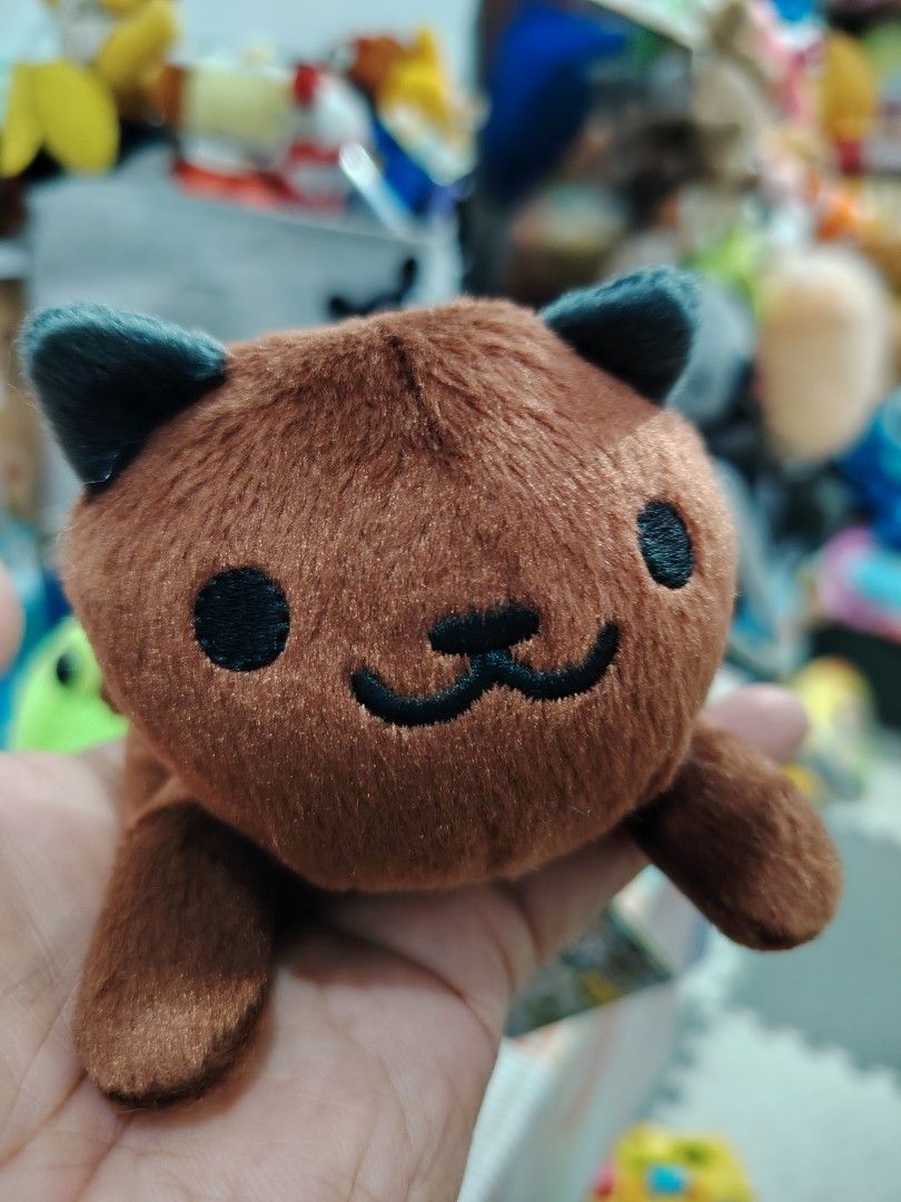 Choco San (Neko Atsume) (Category: Plushies & Soft Toys) located in Pasay City. Submitted by jboxshop (Listing ID 1461972003, Image 2). Description: Super cute brown tanuki plush toy with black eyes and a striped tail. Soft, cuddly, and perfect for collecting or gifting. Like new with papertag.
