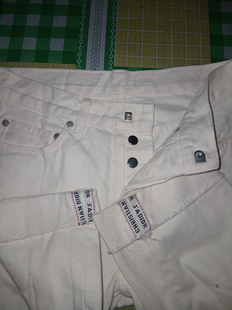 Christian Dior White Denim Jeans (Category: Jeans) located in General Santos City (Dadiangas). Submitted by afsph1996 (Listing ID 1461933461, Image 3). Description: - Christian Dior Crop white denim jeans -Button Fly Fold-up hem dior seams -Waistline 27-28 -Length 38 -Tinangal lahat nag tags - Classic five-pocket style - Button closure - Features Dior J'Adior logo on waistband tabs - Small stain visible on the back pocket area - Great staple piec