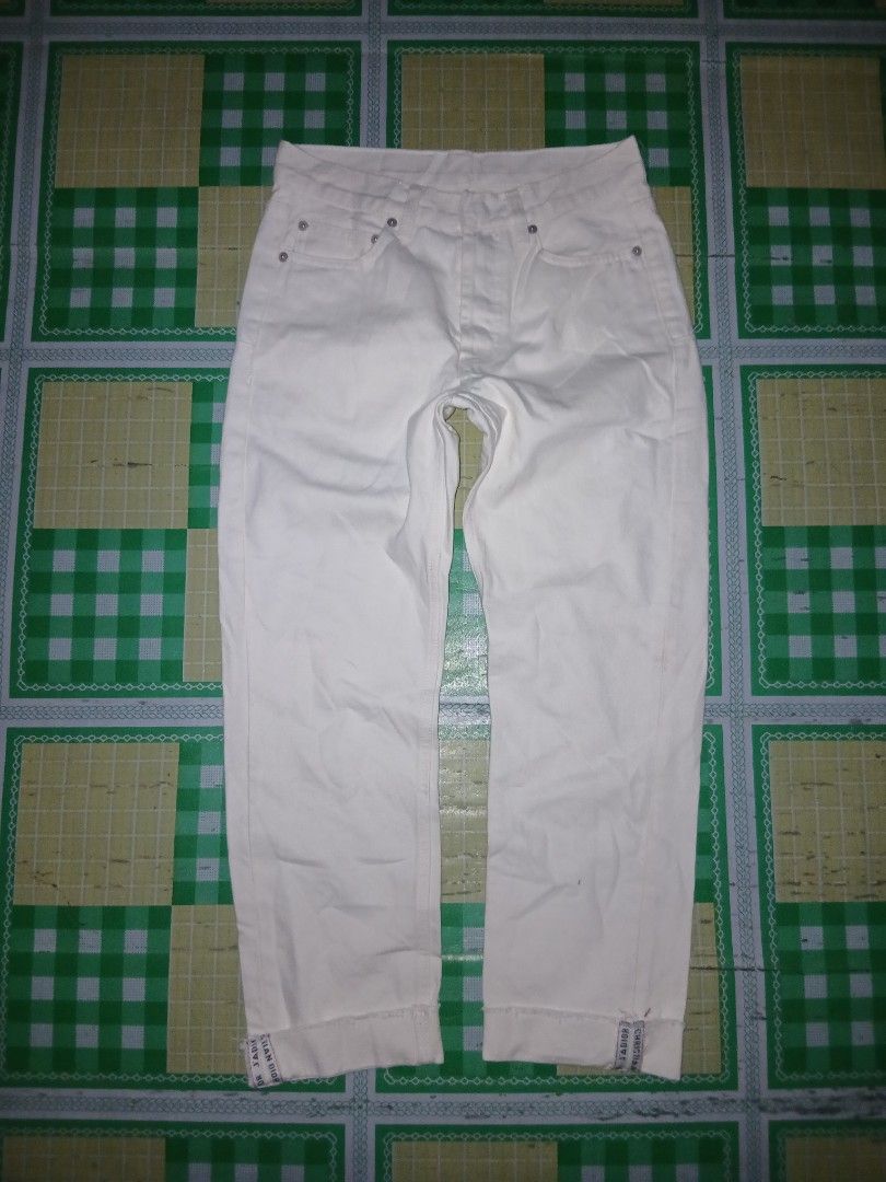 Christian Dior White Denim Jeans (Category: Jeans) located in General Santos City (Dadiangas). Submitted by afsph1996 (Listing ID 1461933461, Image 1). Description: - Christian Dior Crop white denim jeans -Button Fly Fold-up hem dior seams -Waistline 27-28 -Length 38 -Tinangal lahat nag tags - Classic five-pocket style - Button closure - Features Dior J'Adior logo on waistband tabs - Small stain visible on the back pocket area - Great staple piec