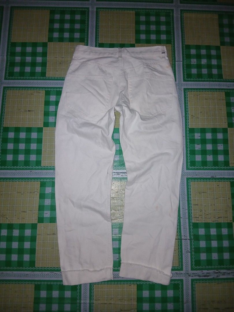 Christian Dior White Denim Jeans (Category: Jeans) located in General Santos City (Dadiangas). Submitted by afsph1996 (Listing ID 1461933461, Image 2). Description: - Christian Dior Crop white denim jeans -Button Fly Fold-up hem dior seams -Waistline 27-28 -Length 38 -Tinangal lahat nag tags - Classic five-pocket style - Button closure - Features Dior J'Adior logo on waistband tabs - Small stain visible on the back pocket area - Great staple piec