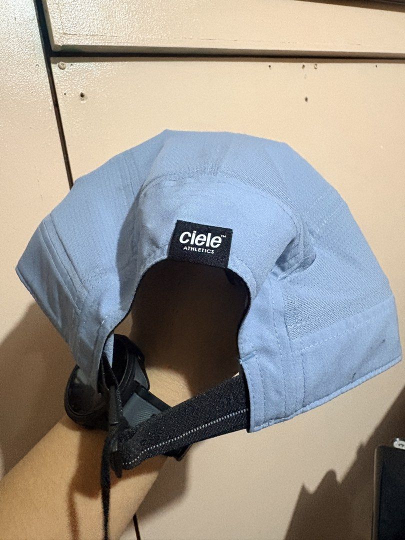 Ciele Athletics GOCAP Ninety-Chambray Cap ML (Category: Activewear) located in Manila. Submitted by yuki0624 (Listing ID 1461946900, Image 2). Description: - Ciele Athletics GOCAP Ninety-Chambray Cap - Size: ML - Color: Light Blue - Made in Vietnam - Fabric: COOLwick for enhanced breathability - Features: Adjustable strap for a customized fit - Ideal for: Running, training, or everyday casual wear.