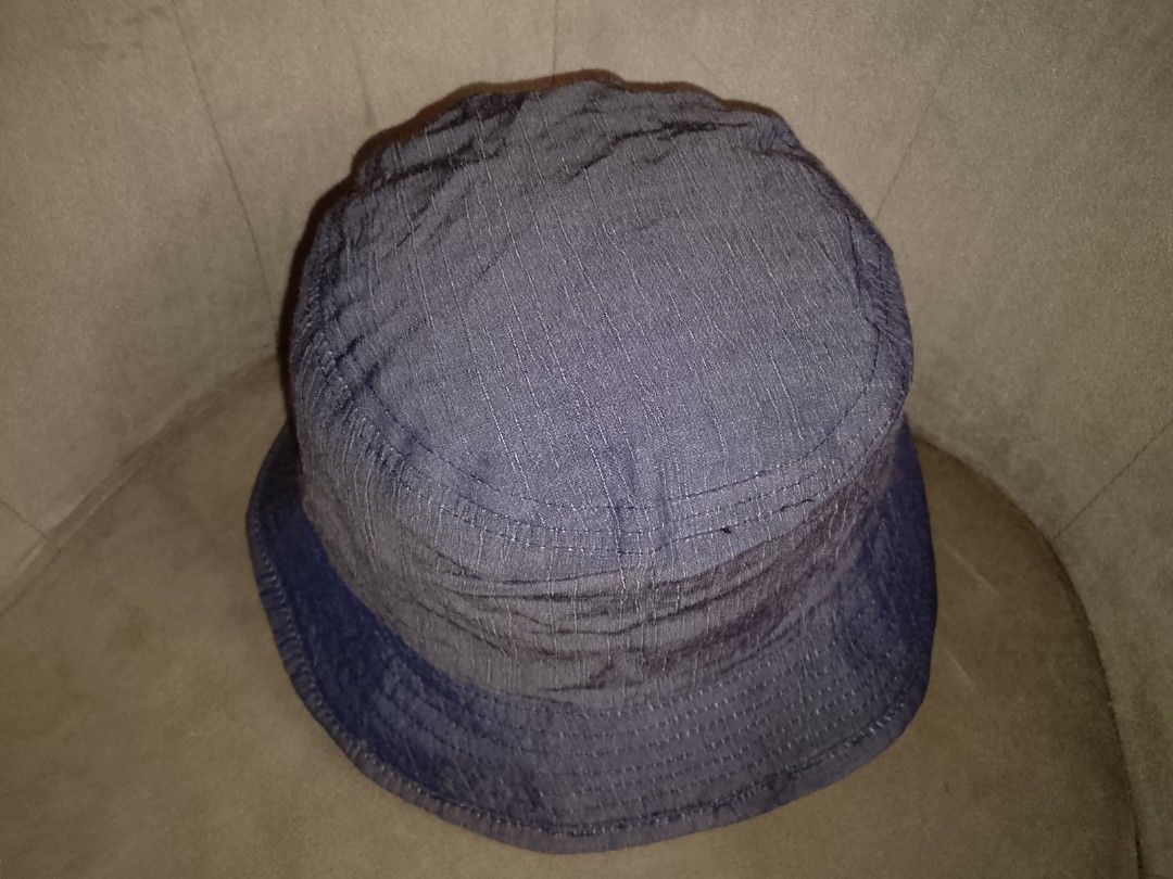 Classic Blue Pinstripe Denim Bucket (Category: Hats & Beanies) located in Binangonan. Submitted by yuristalin888 (Listing ID 1461927392, Image 3). Description: Complete your casual streetwear look with this classic blue bucket hat. Featuring a subtle vertical pinstripe texture, structured brim stitching, and a comfortable lined interior, this versatile accessory delivers effortless style and everyday sun protection..