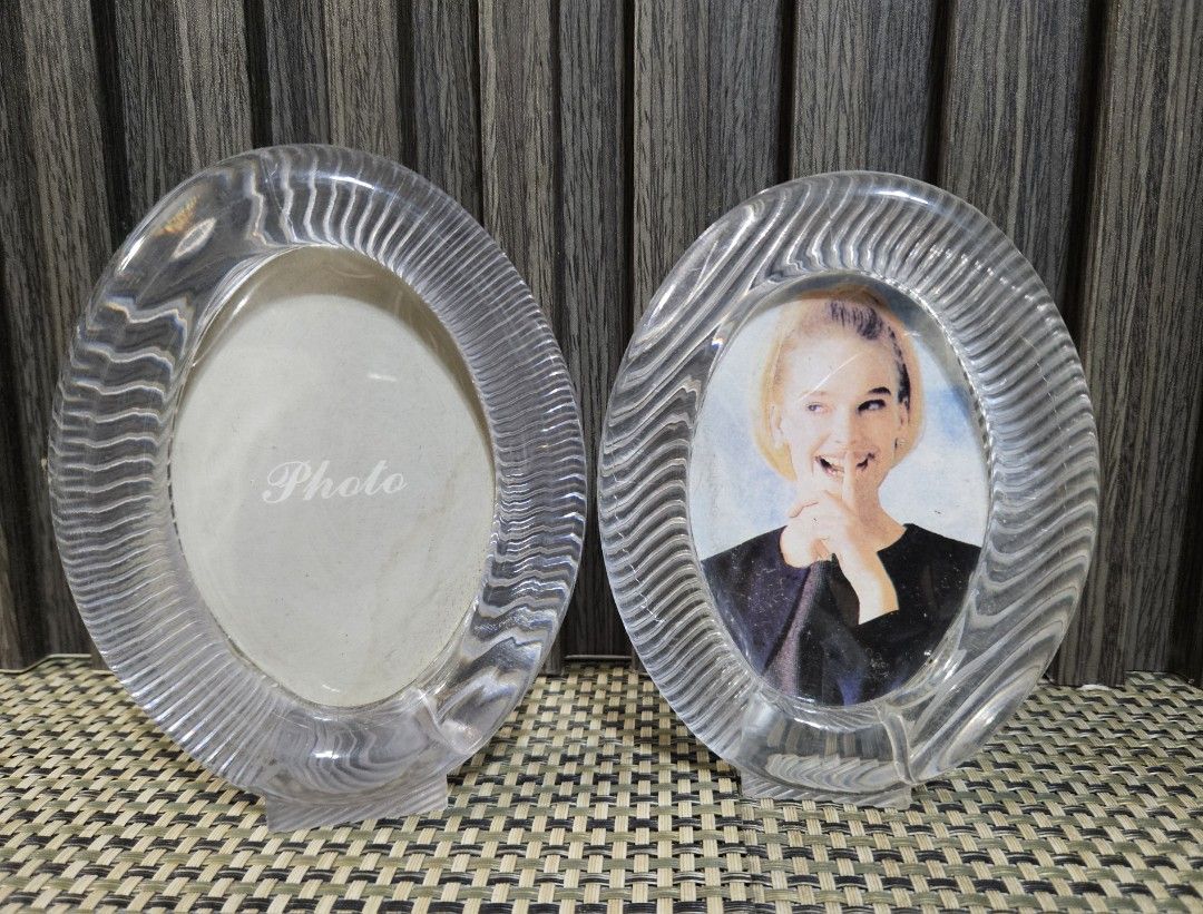 Clear Oval Photo Frames (Set of 2) (Category: Frames & Pictures) located in Rizal. Submitted by cherry_garcia (Listing ID 1461895708, Image 1). Description: - Set of 2 clear oval photo frames - Features a ribbed texture around the edge - Each frame has a small base for upright display - Ideal for showcasing memories on desks, shelves, or tables.