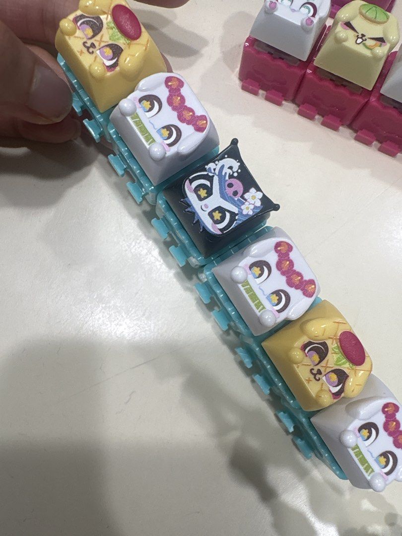 CLICKEEZ Sanrio php 110 each (Category: Computer Keyboard) located in Makati City. Submitted by carclosetjunkie (Listing ID 1461982181, Image 2). Description: - Set of cute animal face keycaps for mechanical keyboards. - Designs include dogs, cats, and a unique black one with a wave pattern. - Novelty keycaps for keyboard customization. - Square shape with bright, fun colors (pink, yellow, white, green). - Adds personality to your keyboard setup.