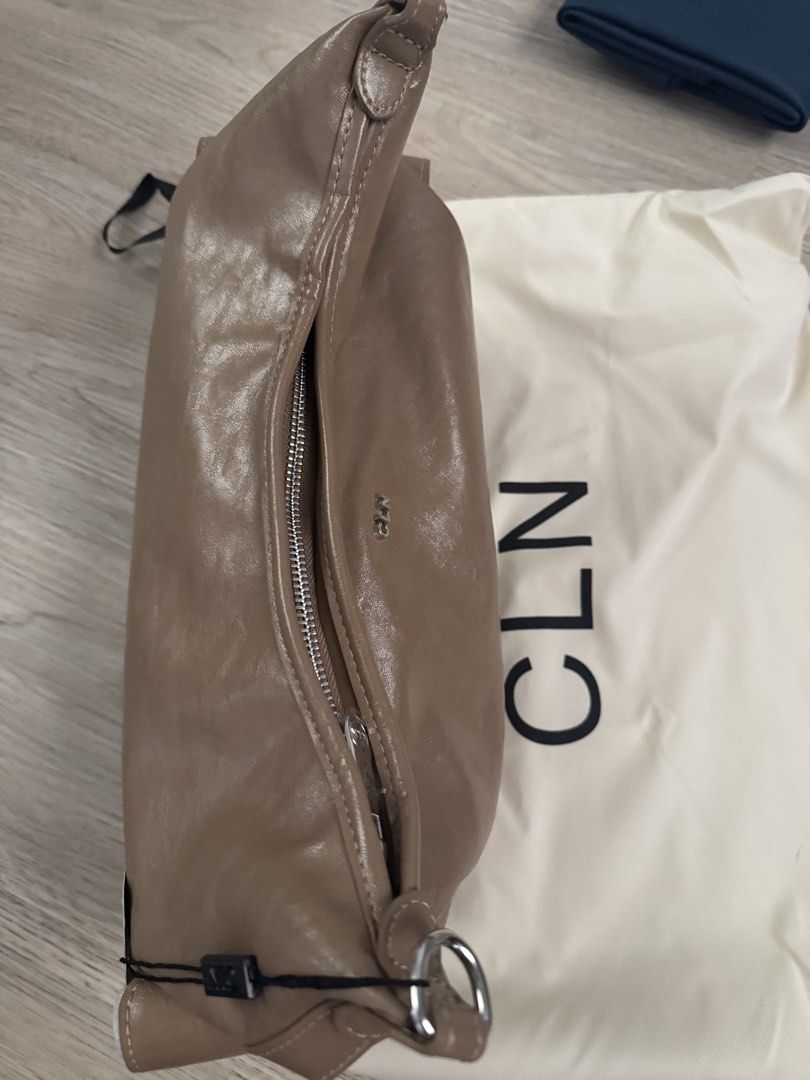 CLN Bag (Category: Shoulder Bags) located in Paranaque City. Submitted by cleverturtle.391c7c (Listing ID 1461806800, Image 1). Description: - Taupe CLN bag - Includes dust bag - Zipper closure - Features a ring detail on the side - Ideal for everyday use.