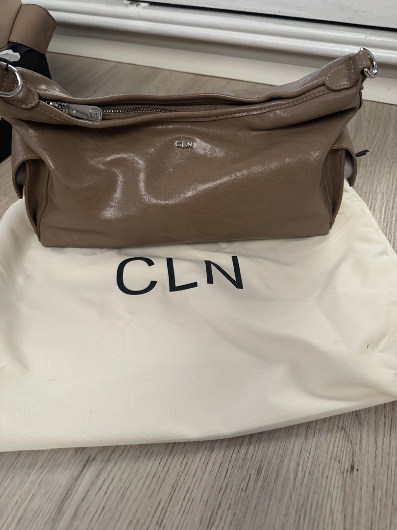 CLN Bag (Category: Shoulder Bags) located in Paranaque City. Submitted by cleverturtle.391c7c (Listing ID 1461806800, Image 2). Description: - Taupe CLN bag - Includes dust bag - Zipper closure - Features a ring detail on the side - Ideal for everyday use.